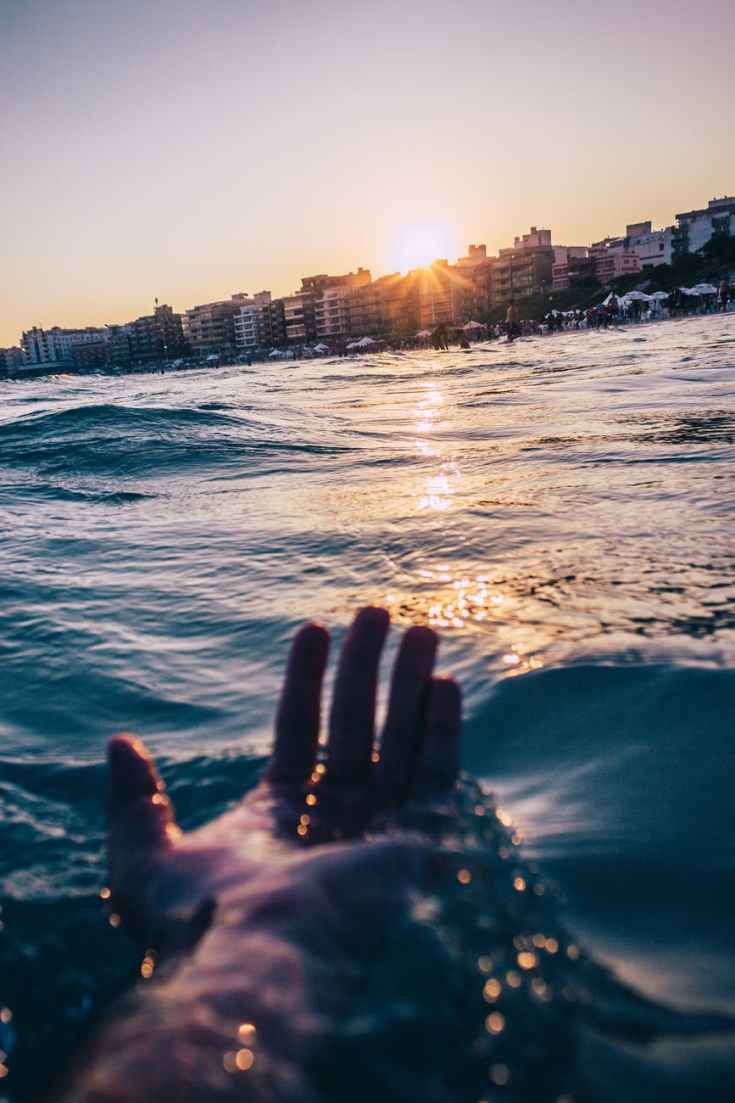 person soaking at the beach